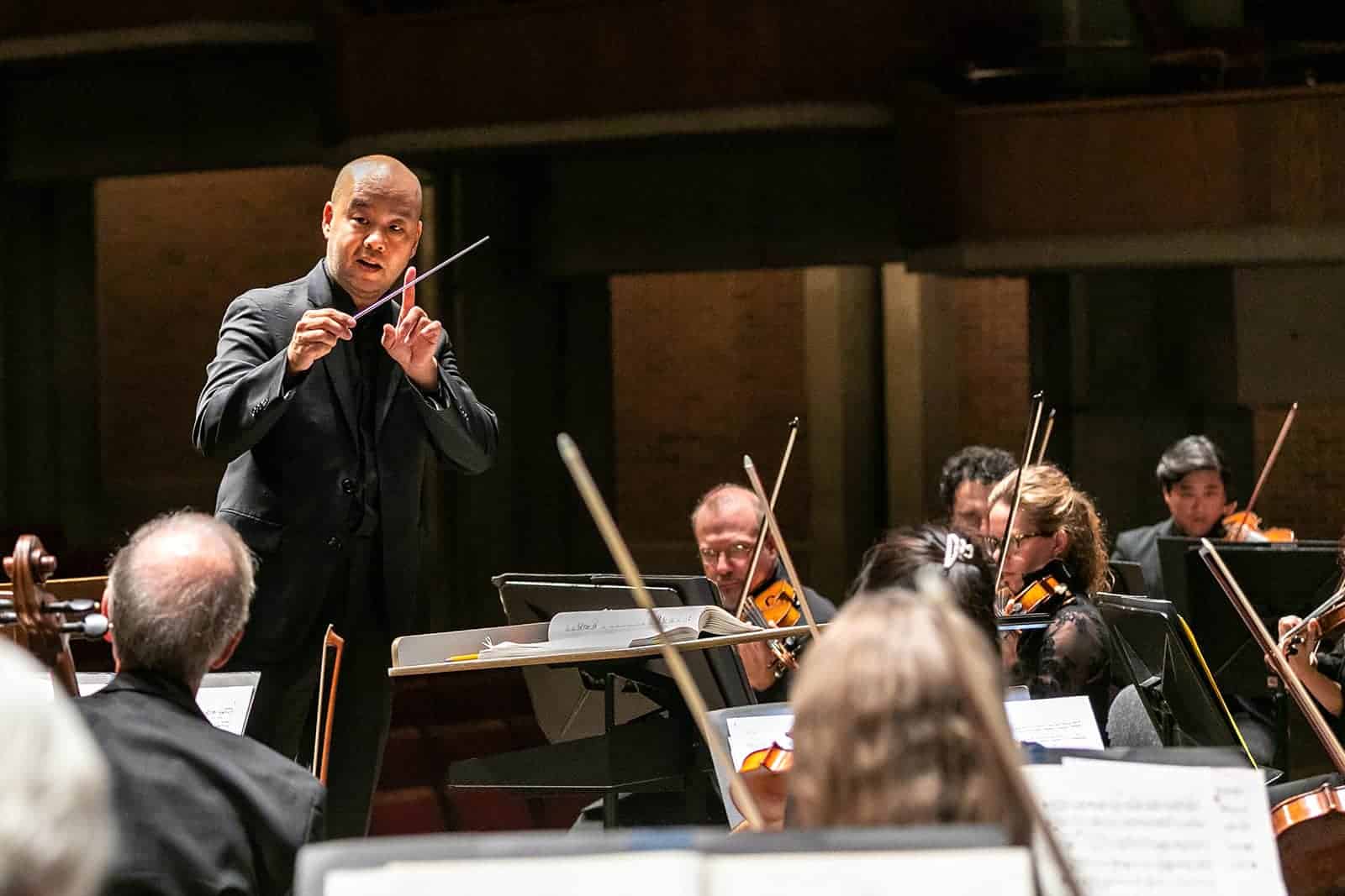 Conductor Lawrence Loh leads Symphoria’s orchestra during a performance at the Crouse-Hinds Theater at The Oncenter.