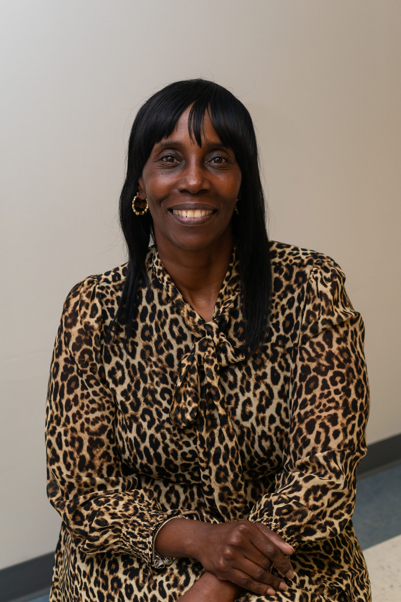 Tara Harris professional headshot with leopard print blouse