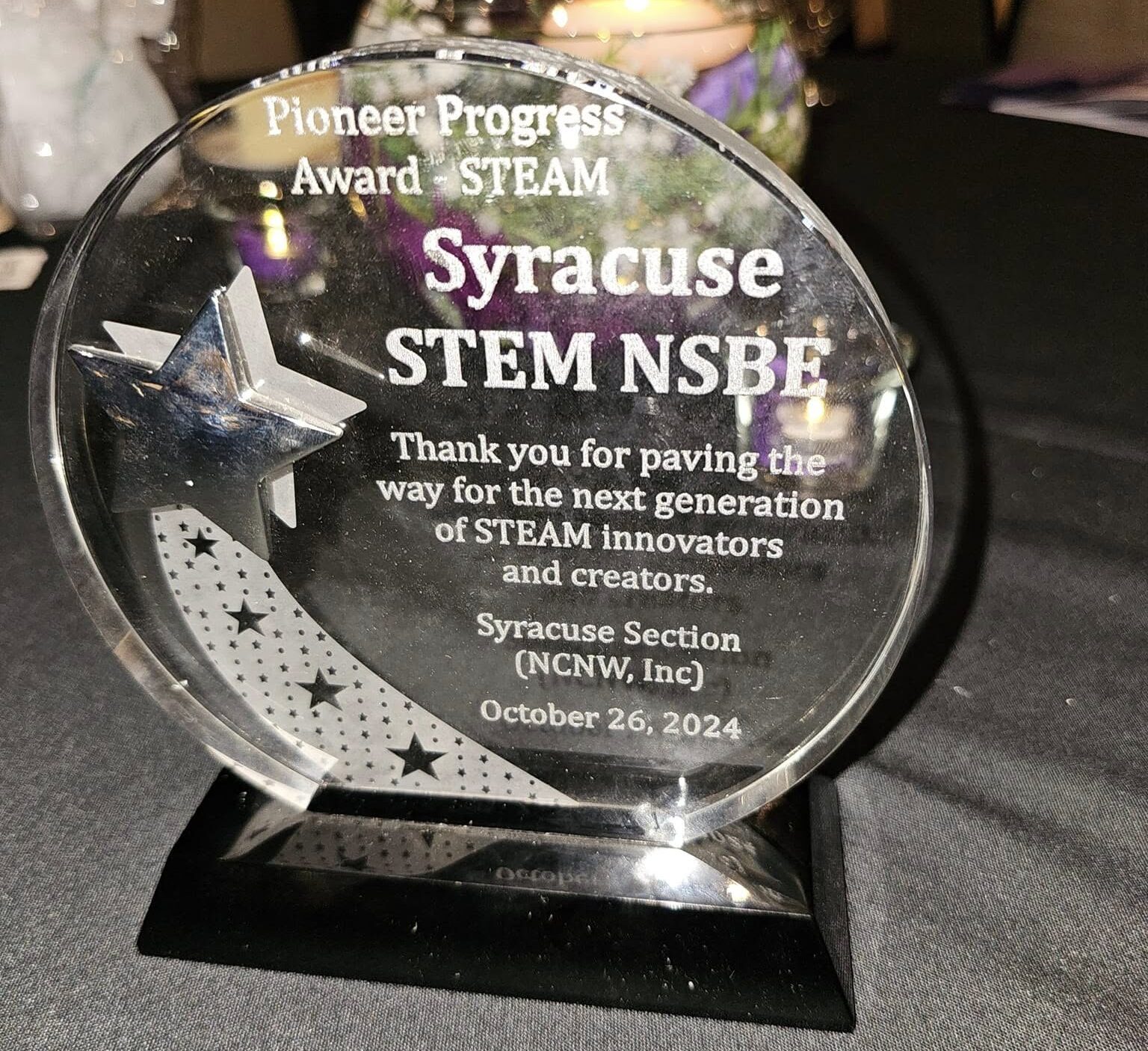 Syracuse STEM round glass award from Pioneer Progress STEAM