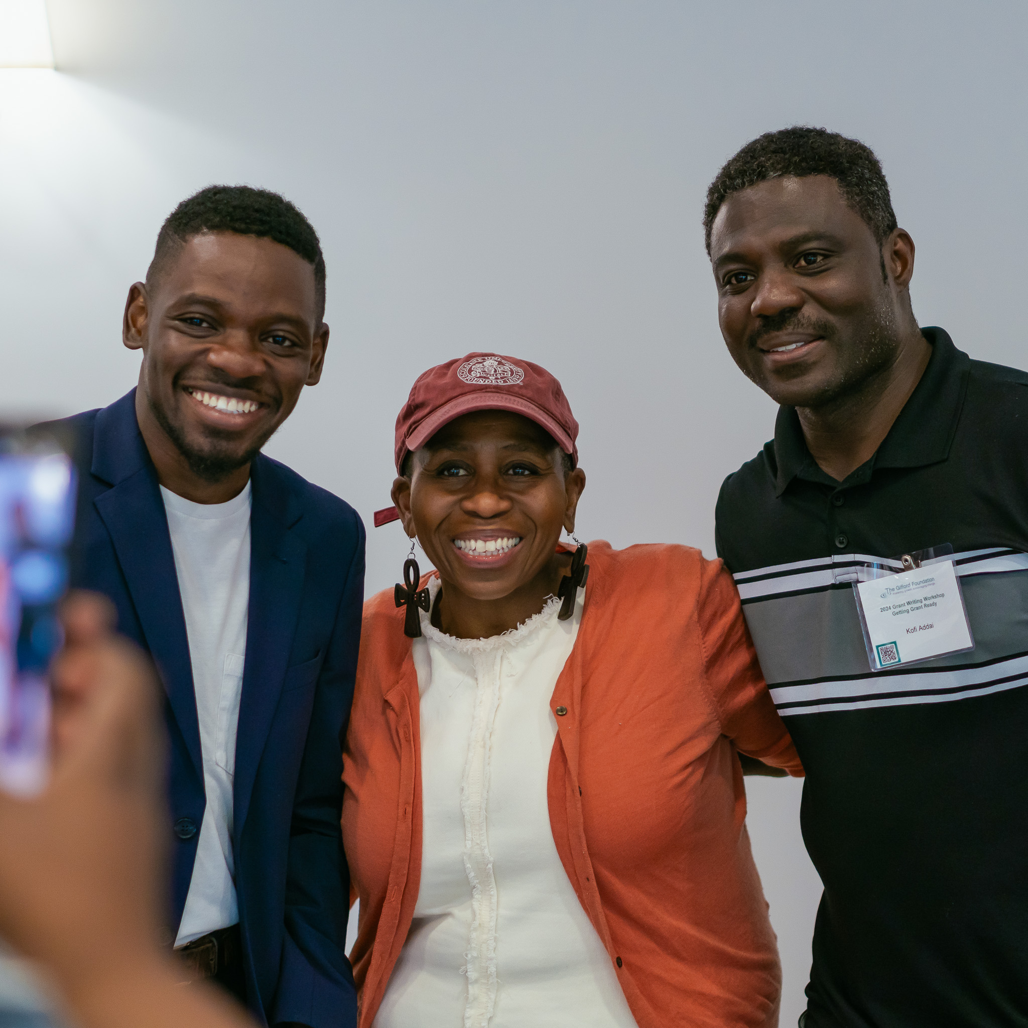 Consultant Babette Baker posing for a picture with two participants of grant 