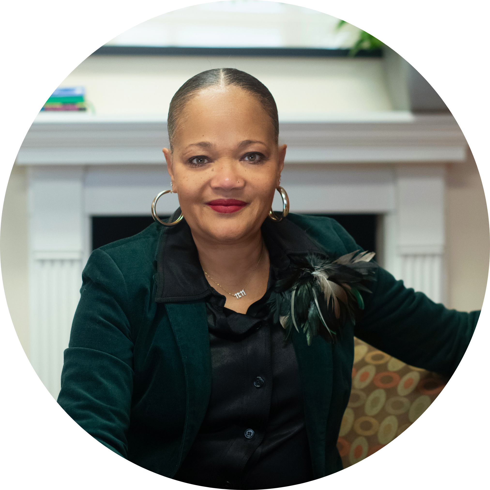 Professional headshot of Melanie Littlejohn  - Black button shirt down with black blazer