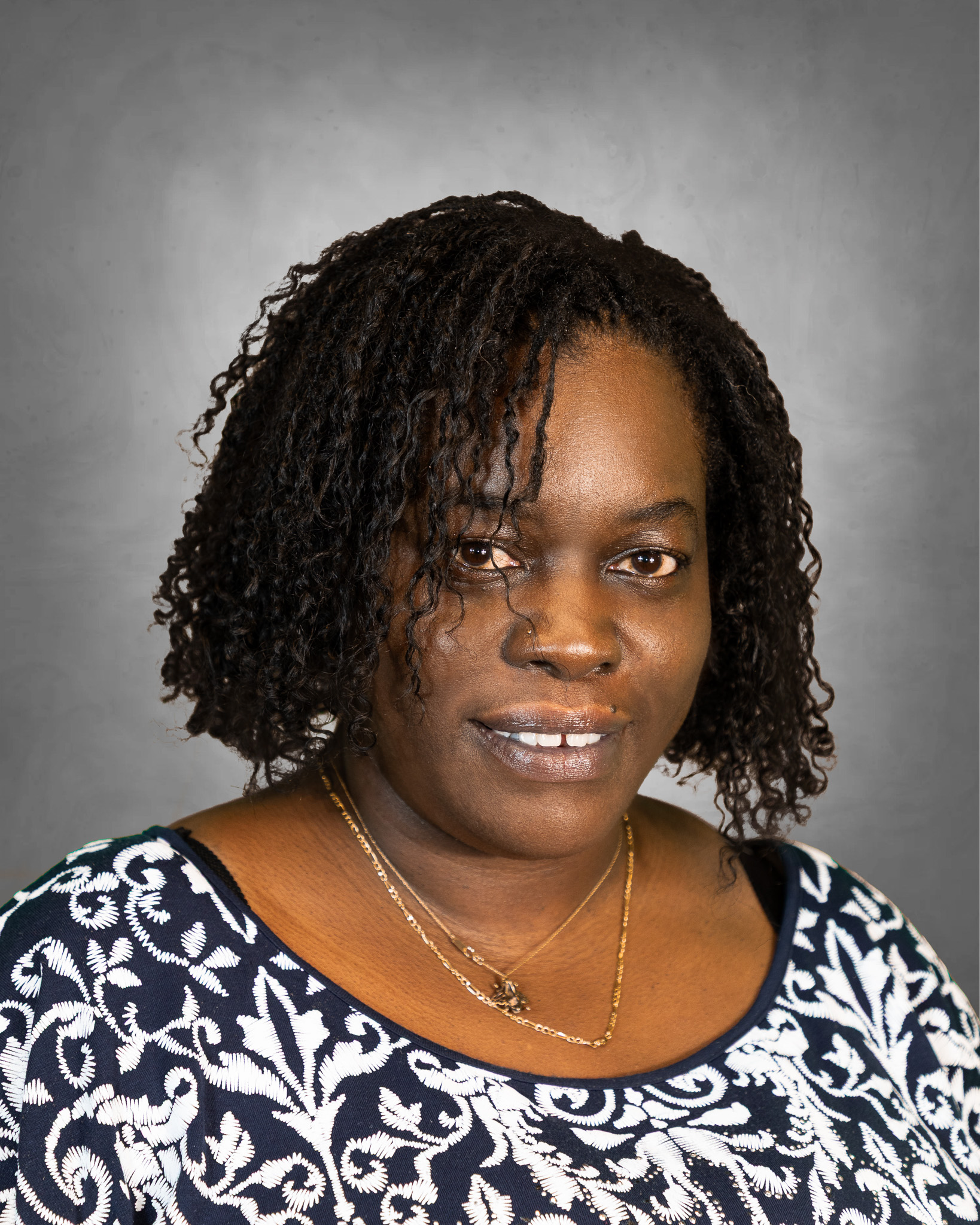 Tara Harris professional headshot with leopard print blouse