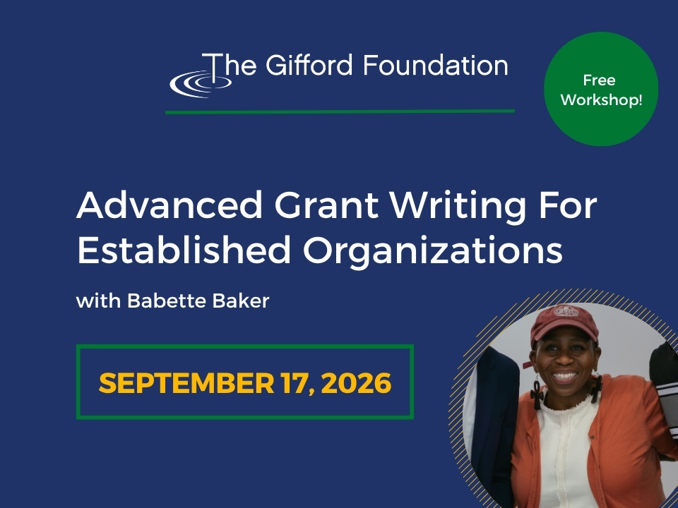 Adv Grant Writing A man operating a small backhoe in a basement of a building that is being constructed