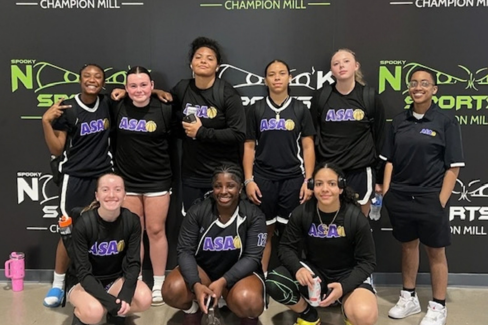 ASA AAU girls basketball team wearing black jerseys with purple ASA logo on front